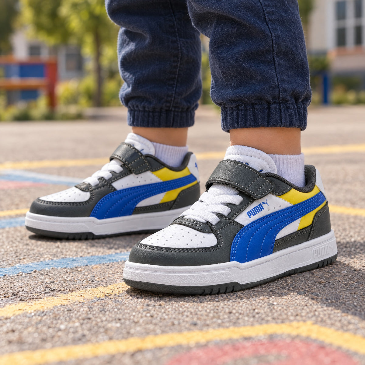 Puma Caven III Block AC+ PS Sarı-Lacivert Çocuk Sneaker - çocuk ayağında kullanım görseli